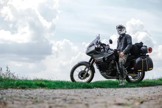 motorbike and biker at side of the road 